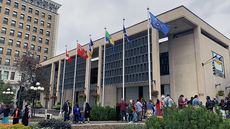 Three flags of Treaty One at City Hall