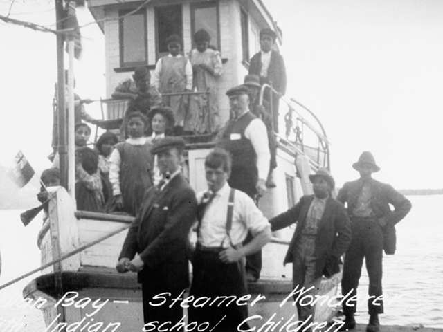 Picture of children on boat going to the Cecilia Jeffrey Indian Residential School near Shoal Lake.