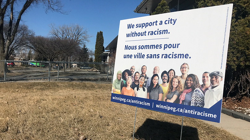 A lawn sign promotes the City of Winnipeg's anti-racism campaign
