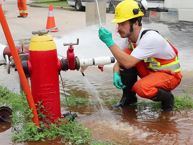 Crews take samples to test the water during the process.