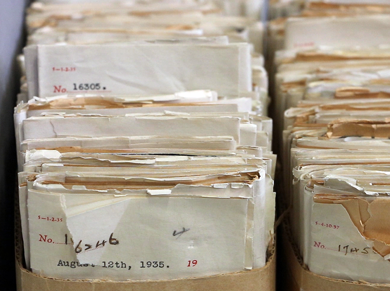 Two stacks of letters to City Council are filed in cardboard at the Council Communications series at the City of Winnipeg Archives. The date "August 12th, 1935" is visible on the front letter.