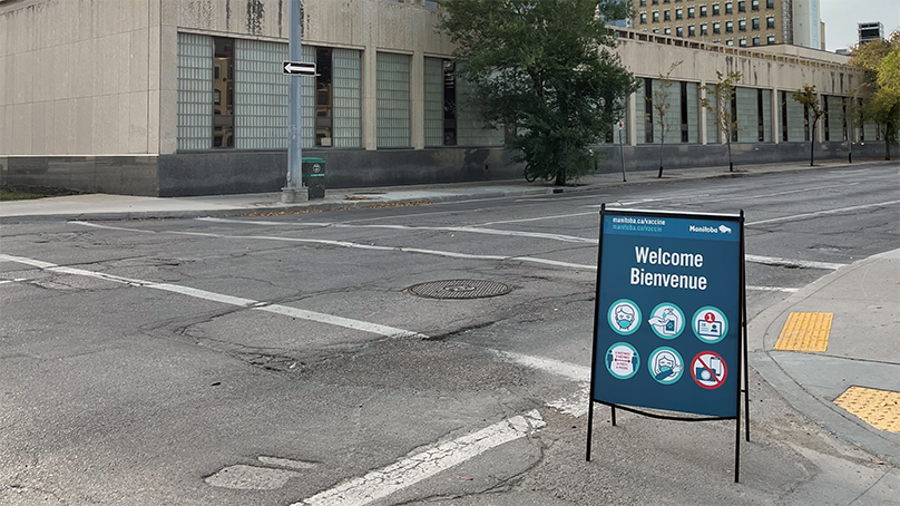 sign outside of city hall advertising covid 19 vaccine clinic