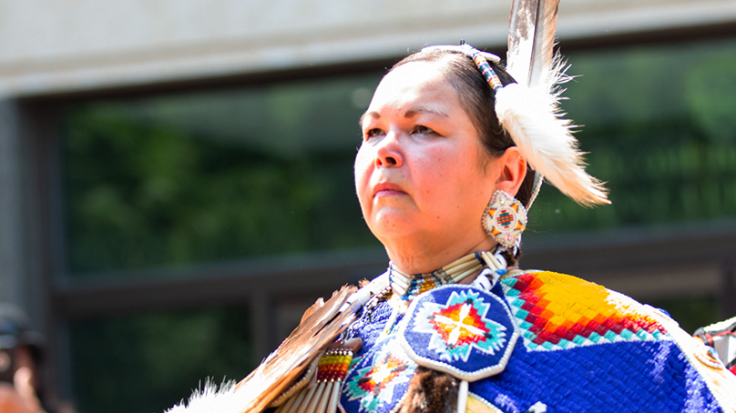 Person in traditional indigenous clothing at National Indigenous Peoples Day in 2018