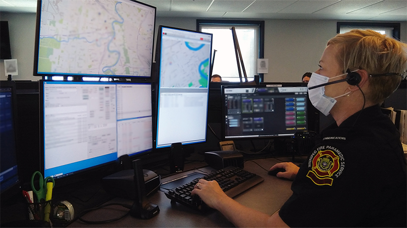 A Winnipeg Fire Paramedic Service (WFPS) 911 call-taker working with the new computer-aided dispatch system.
