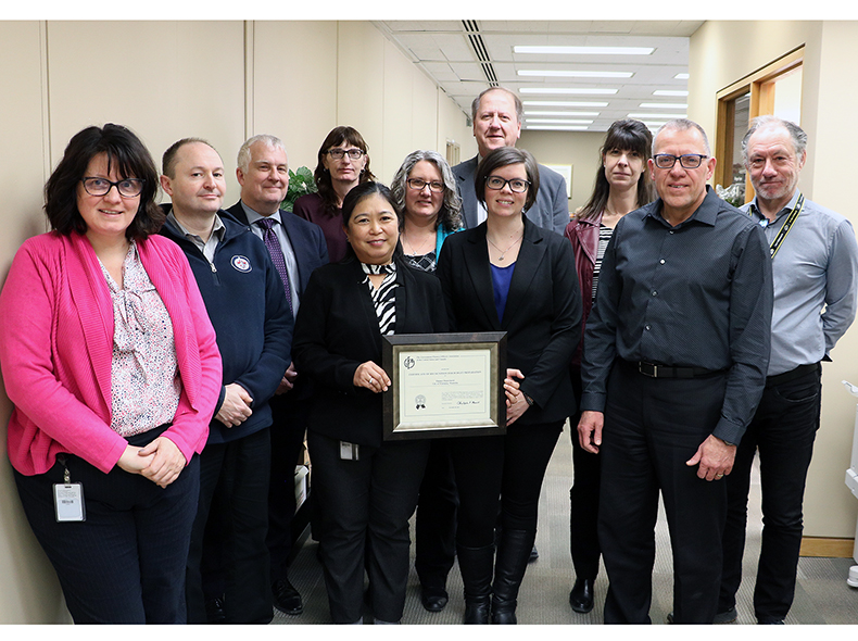 Finance Department team holding framed 2019 Distinguished Budget Presentation Award