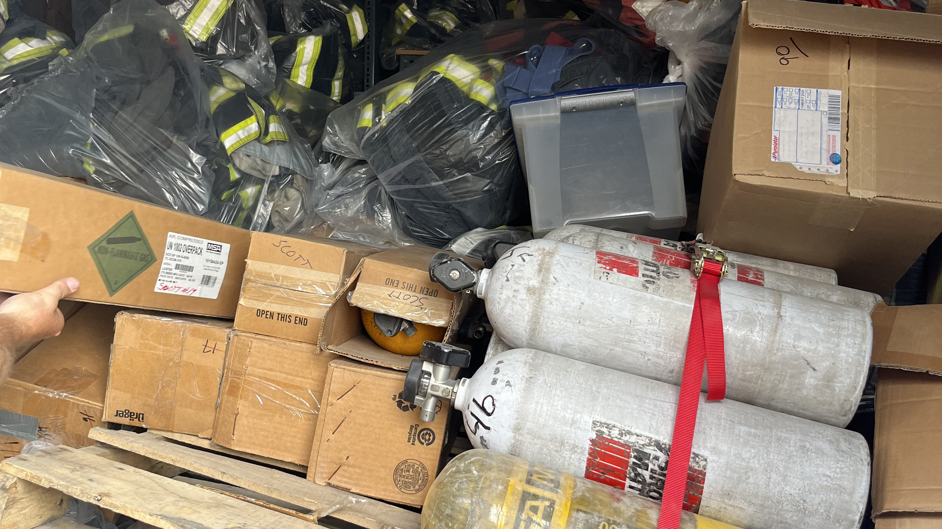 Firefighting gear is packed up in a truck.