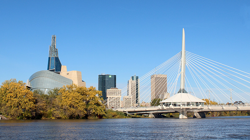 View of downtown Winnipeg with the red river, esplanade Riel and Canadian Museum for Human Rights