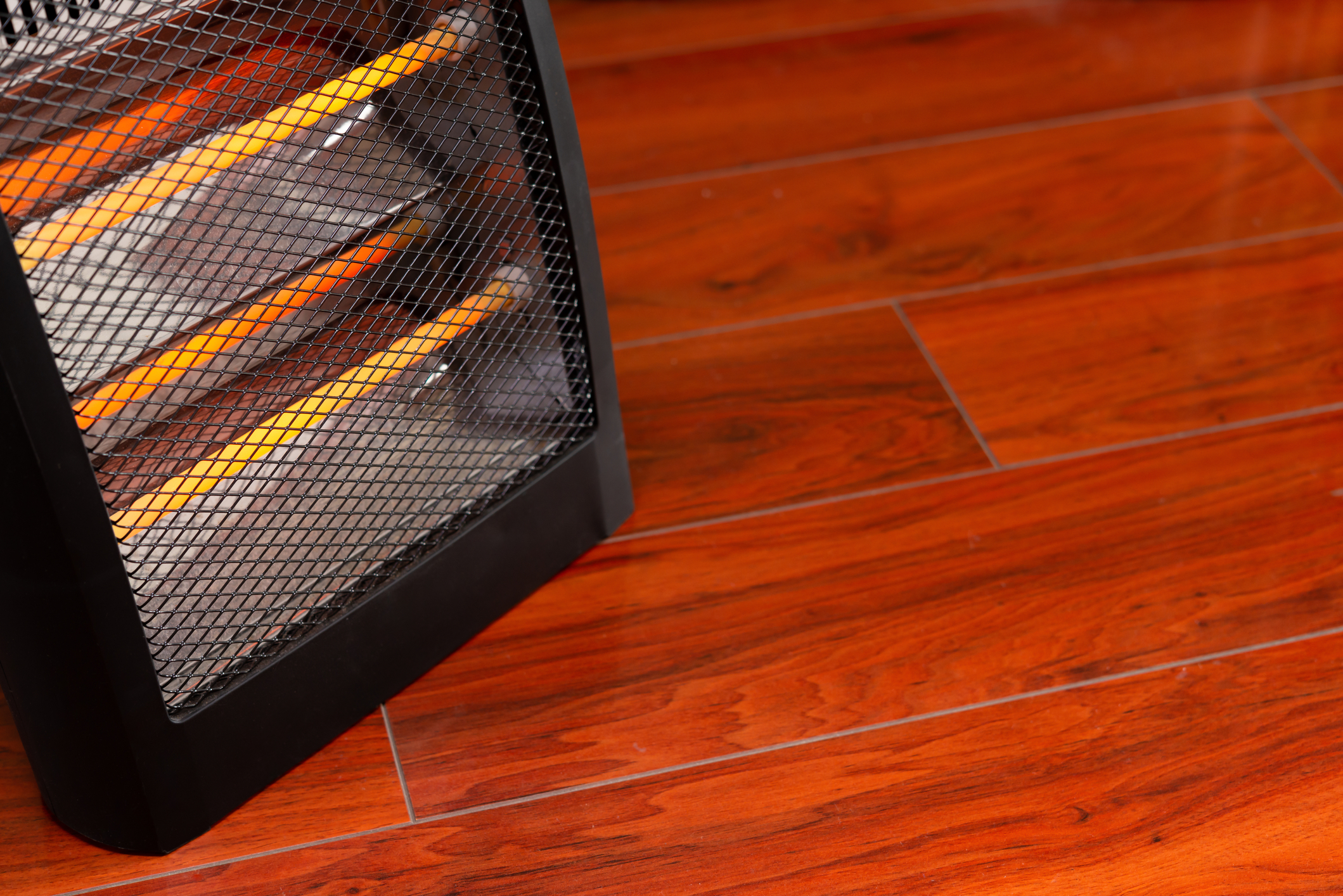 A space heater sits on the floor.