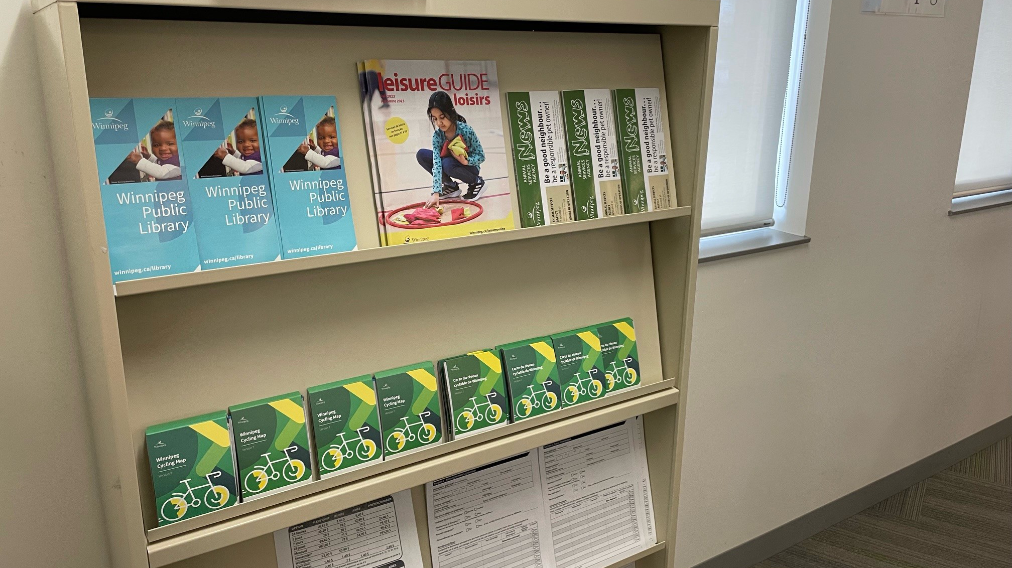 Pamphlets are seen on a shelf