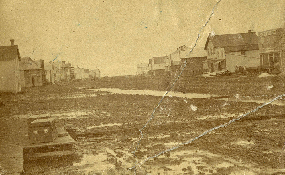Muddy roads are seen in a sepia tone archival photo