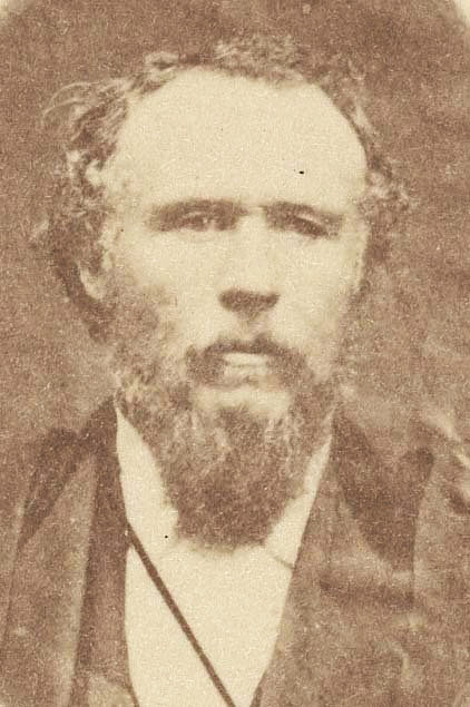 An archival image of a man with a beard.