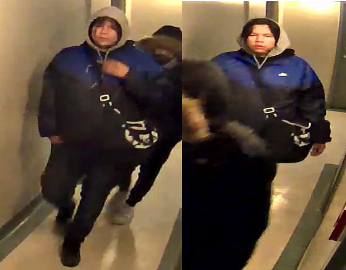 Person with hoodie and blue jacket and duffle