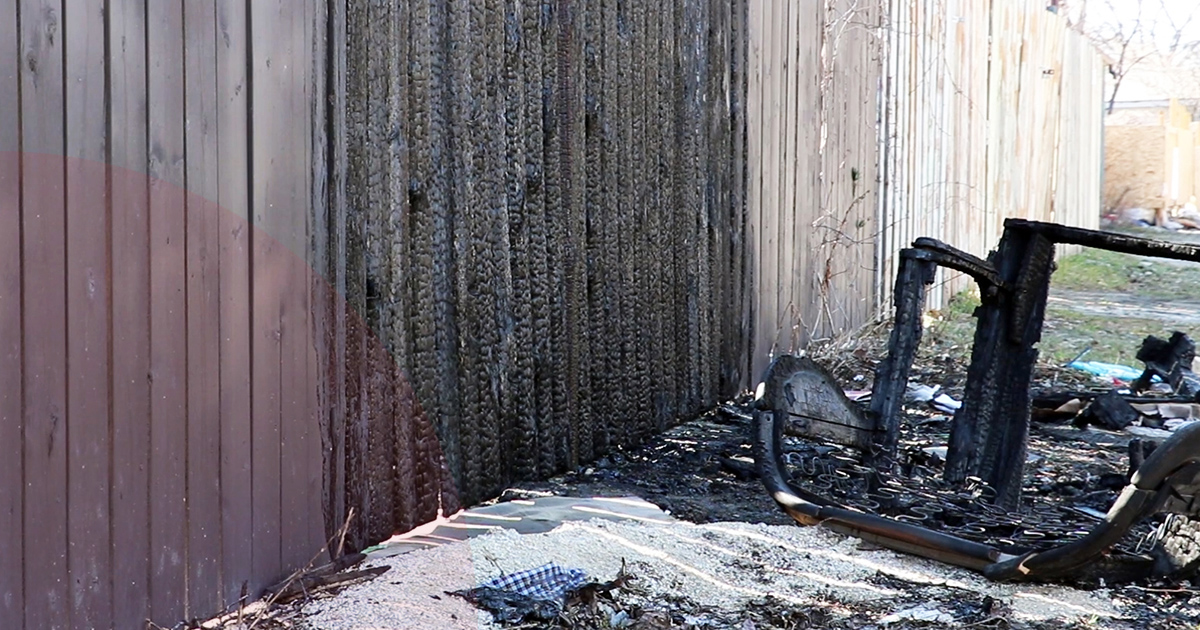 A charred fence