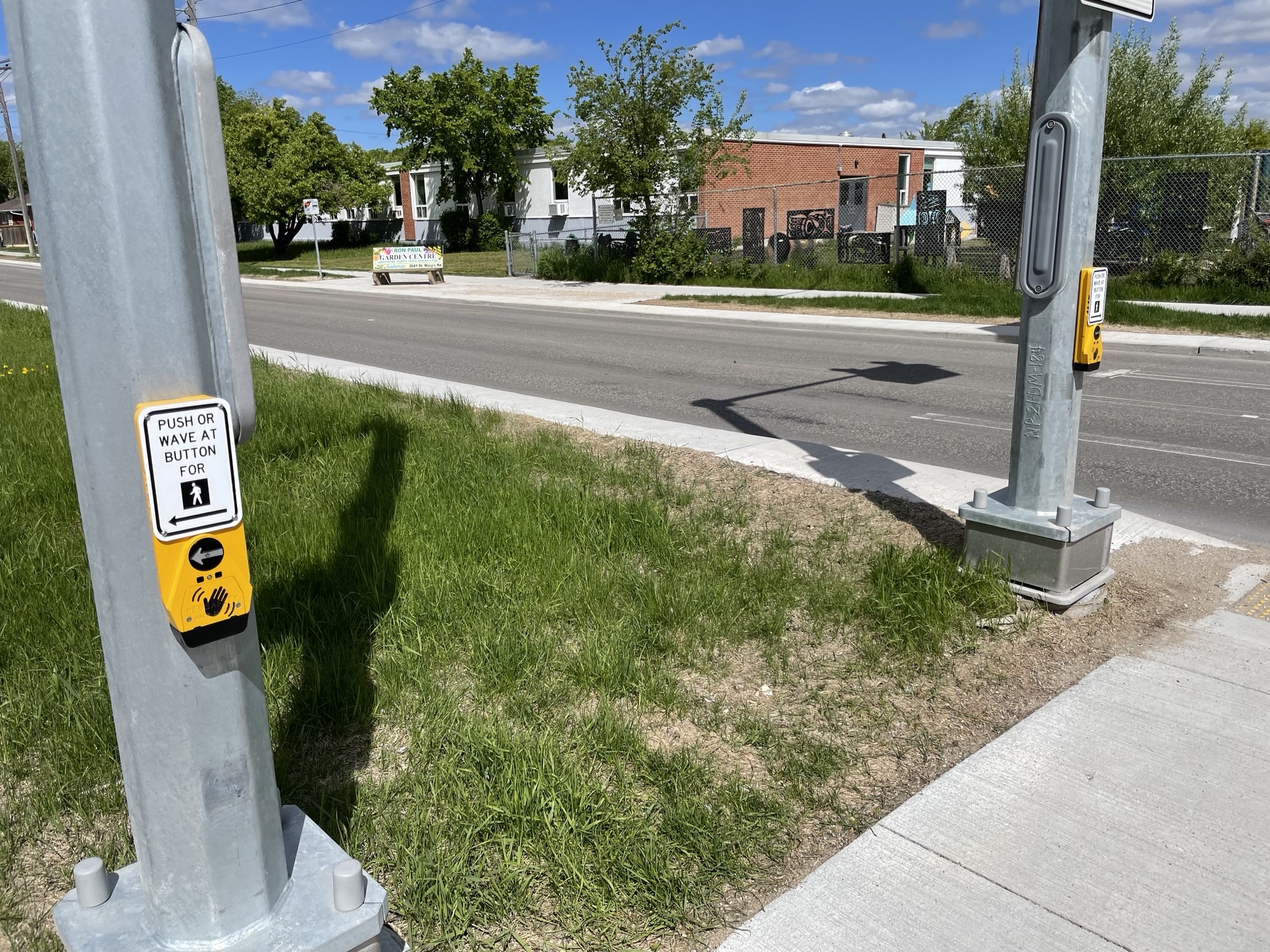 A wide median stands in the middle of a street.