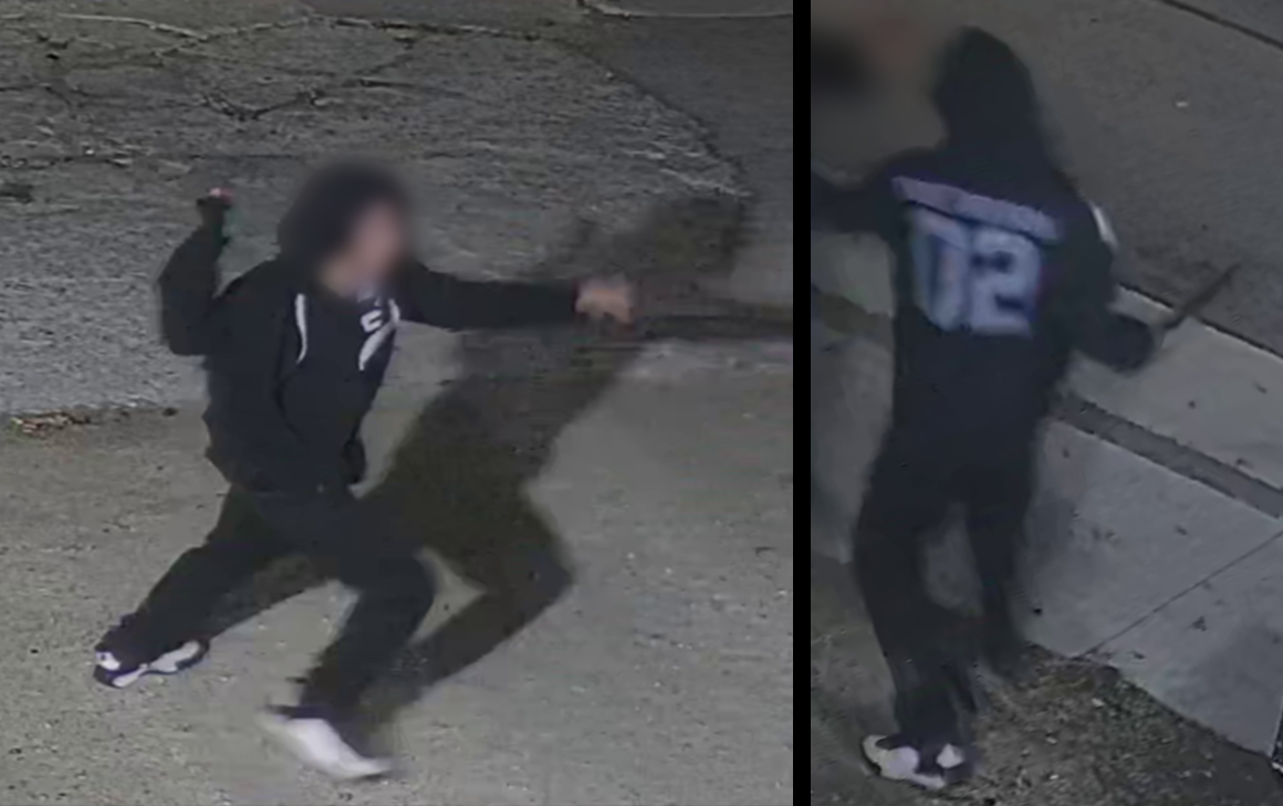 Male suspect wearing a dark hoodie with the number 02 in white across the back
