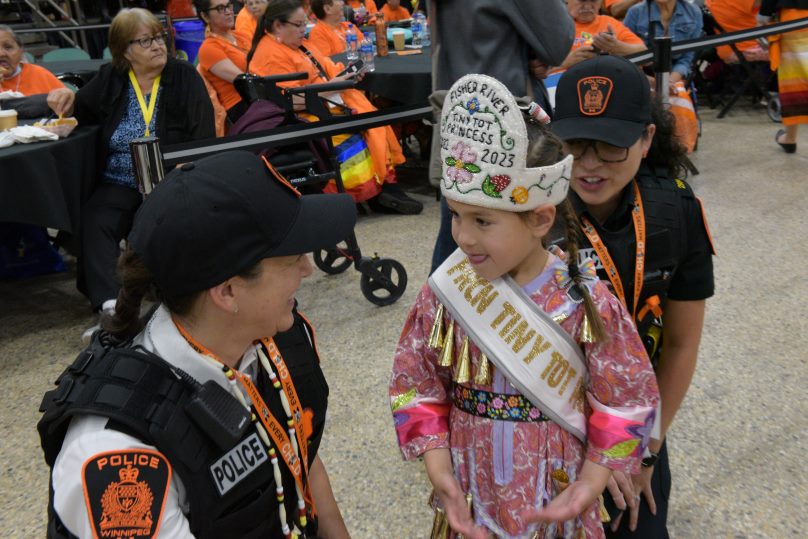 Bonnie Emerson engages with a Child at Orange Shirt Day event