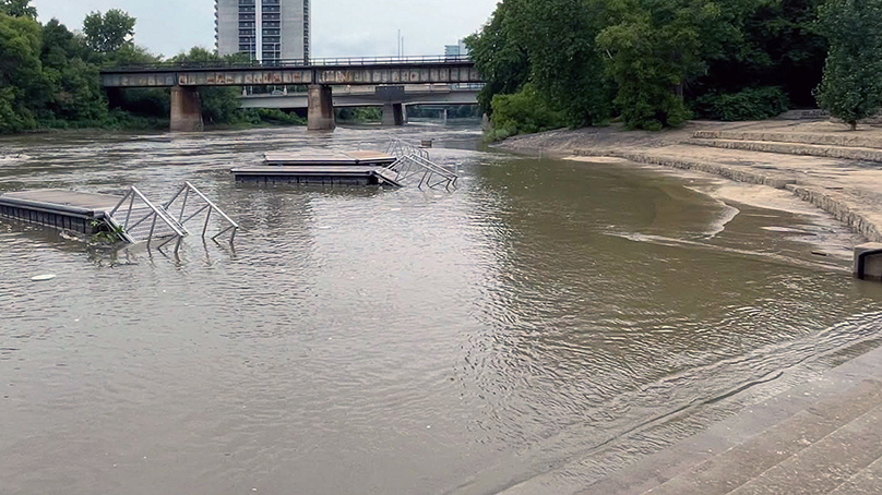 River water over a walkway at the Forks