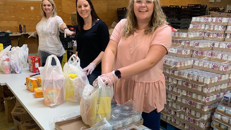 City of Winnipeg employees providing assistance at local food bank