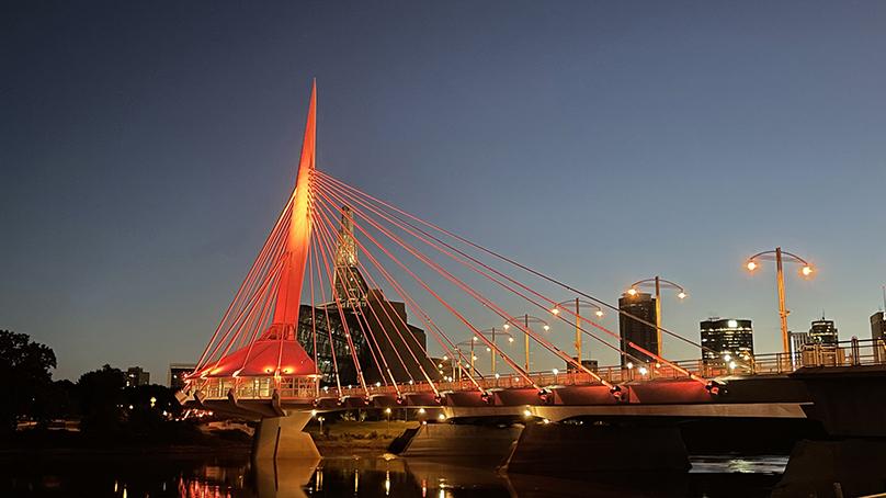 The new lighting system on Esplanade Riel can be programmed to illuminate the bridge in any colour.