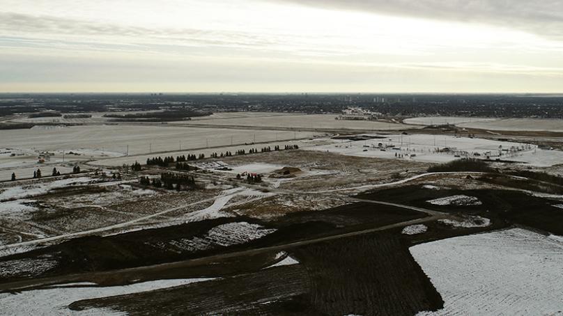 Fabricated soil is spread on the closed Summit Road Landfill.