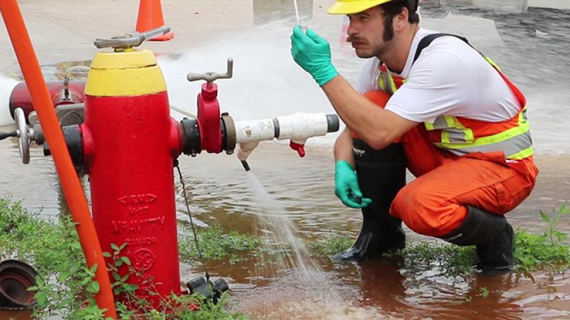 Crews take samples to test the water during the process.