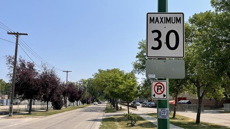 Reduced speed limit sign on Machray Avenue for neighbourhood greenway pilot program