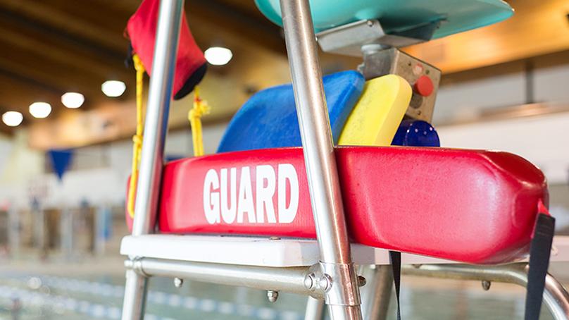 Guard flotation device on a lifeguard stand at an indoor pool