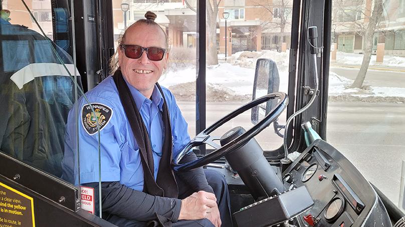 Transit Operator Joseph Fullmer inside his bus