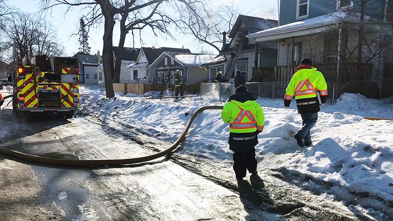 Emergency Social Services team members at a house fire. 