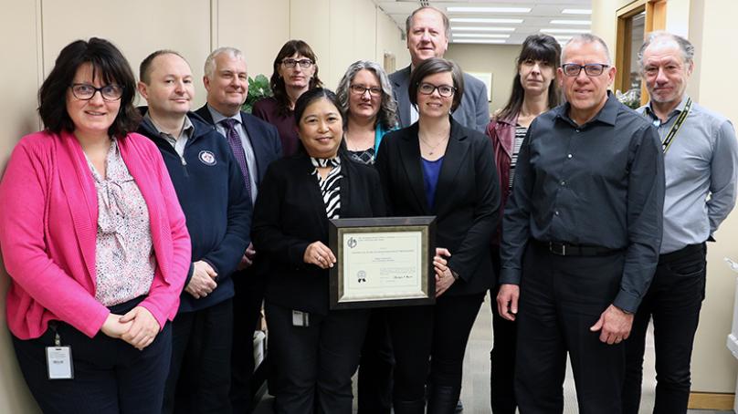 Finance Department team holding framed 2019 Distinguished Budget Presentation Award