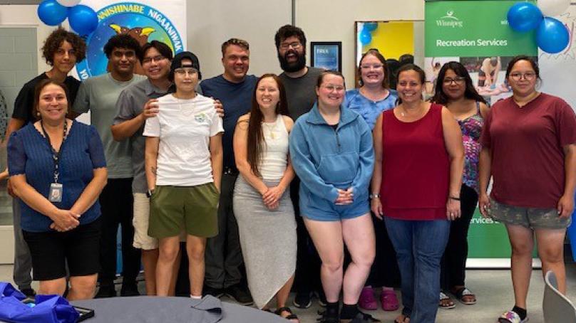 Staff celebrate with participants of the Youth Lifeguard Recruitment Program.