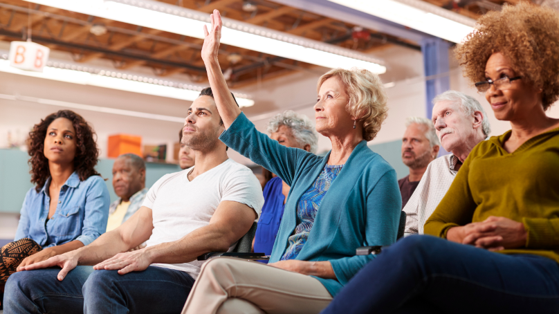 ground of people listening to a presentation
