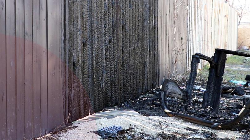 A charred fence