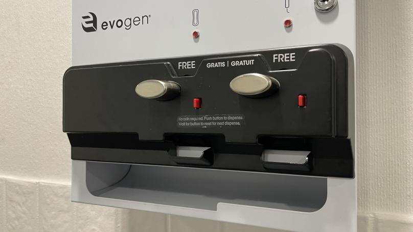 A machine offers free pads and tampons.