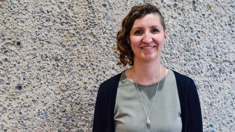 Community Crisis worker standing in front of concrete wall