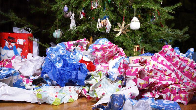 Used wrapping paper in front of Christmas tree