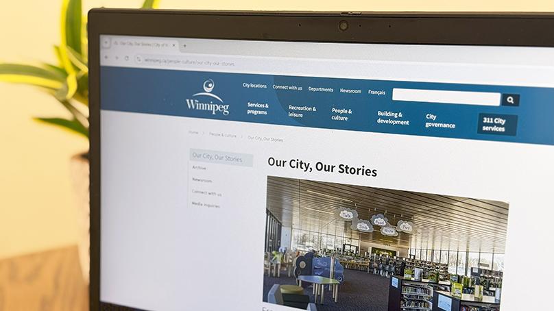 Computer showing Our City, Our Stories home page