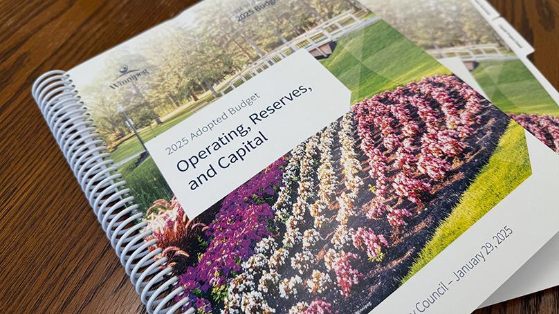 The 2025 Adopted Budget on top of a table