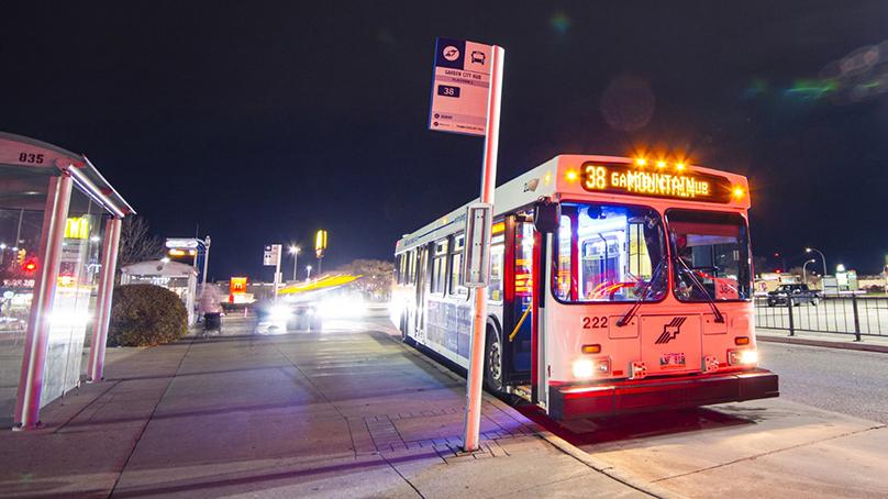 Winnipeg Transit bus at a stop at night