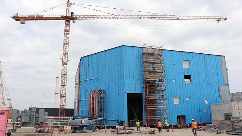 construction crews working on a large building