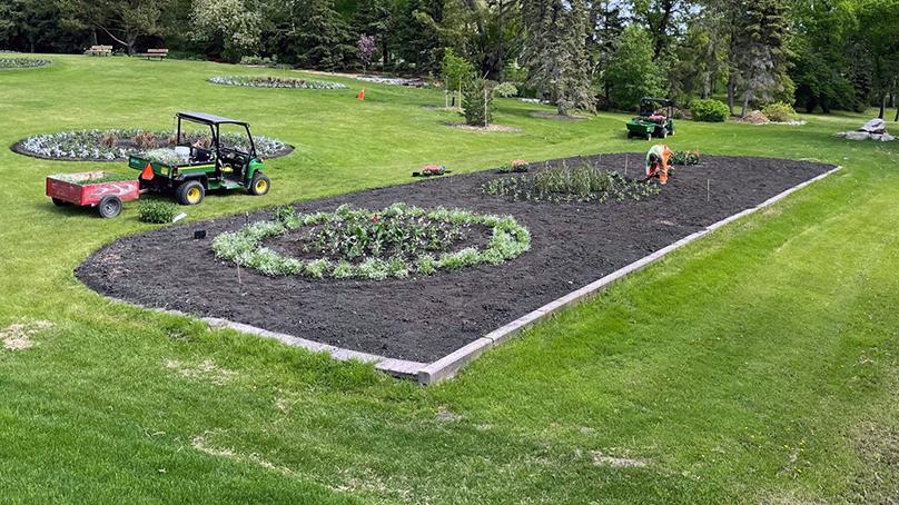Crews planting in Kildonan Park in June. Floral display planting was delayed by about two weeks.