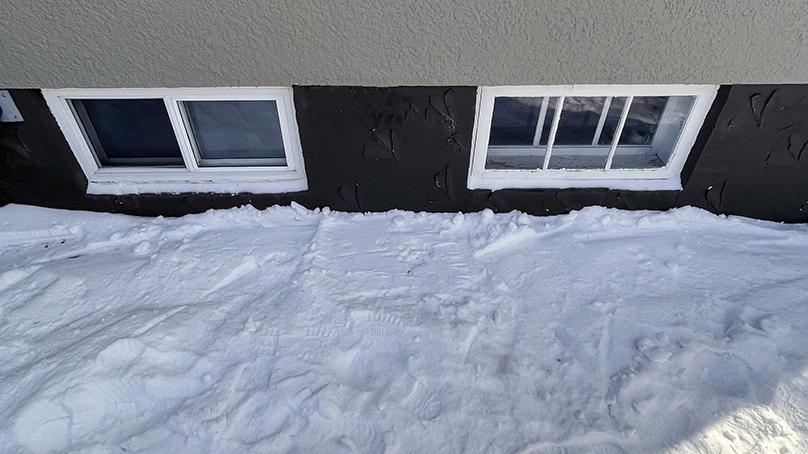 Move snow away from windows and inside window wells.