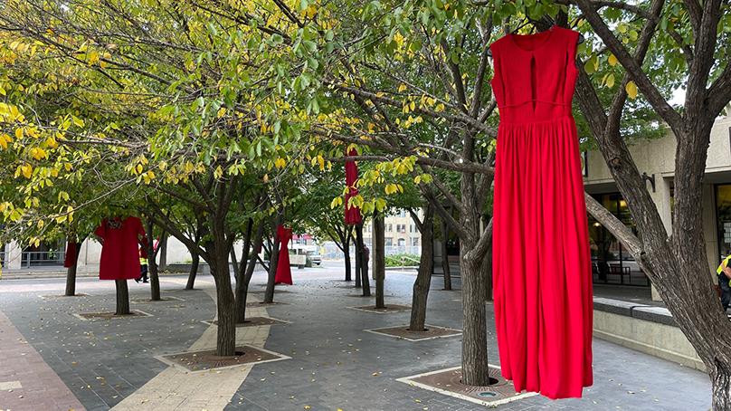 Red dresses hang in the City Hall courtyard on October 4, the National Day of Action for Missing and Murdered Indigenous Women, Girls and 2SLGBTQ+ people.