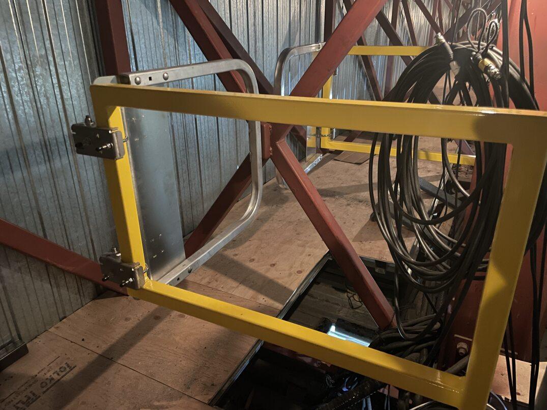 Winnipeg Fleet Management Agency custom built gates around an open area in the lighting bridge to prevent people from falling. 