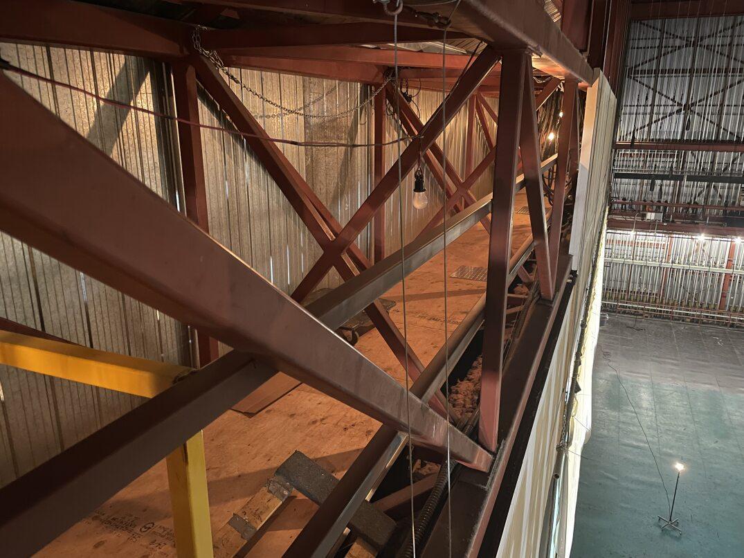 A new staircase and decking was added for catwalk access above the stage, including guard rails and plates to cover wires. 