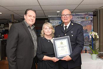 Volunteer Coordinator Paul Gillespie, Ms. Bo Hancox and Acting Chief Art Stannard