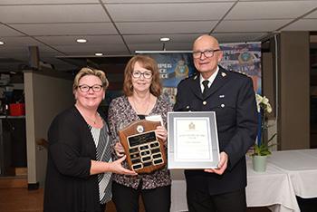 Volunteer Coordinator Marla Lewis, Ms. Janice Bosowec and Acting Chief Art Stannard
