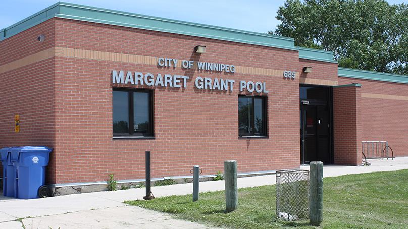 Margaret Grant Pool is spelled out in silver letters near the entrance of the red brick building.