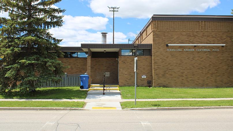 Concrete stairs lead up to the Transcona Kinsmen Centennial Pool on a summer day.
