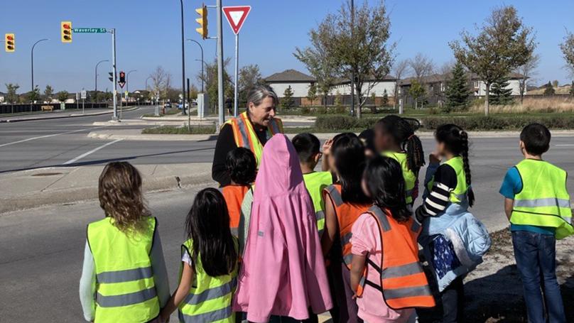 Students learn how to navigate streets, crosswalks, and intersections safely.